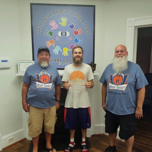 Presentation of grant to Helping Hands leader